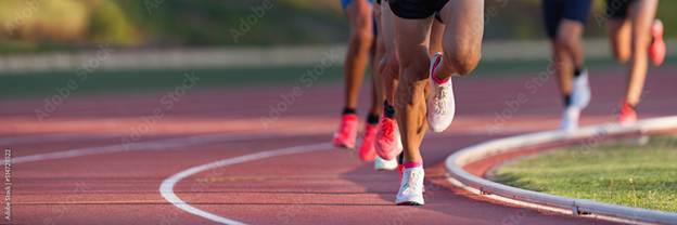 Athletics people running on the track field.Running a race on a track for sports competition and winning